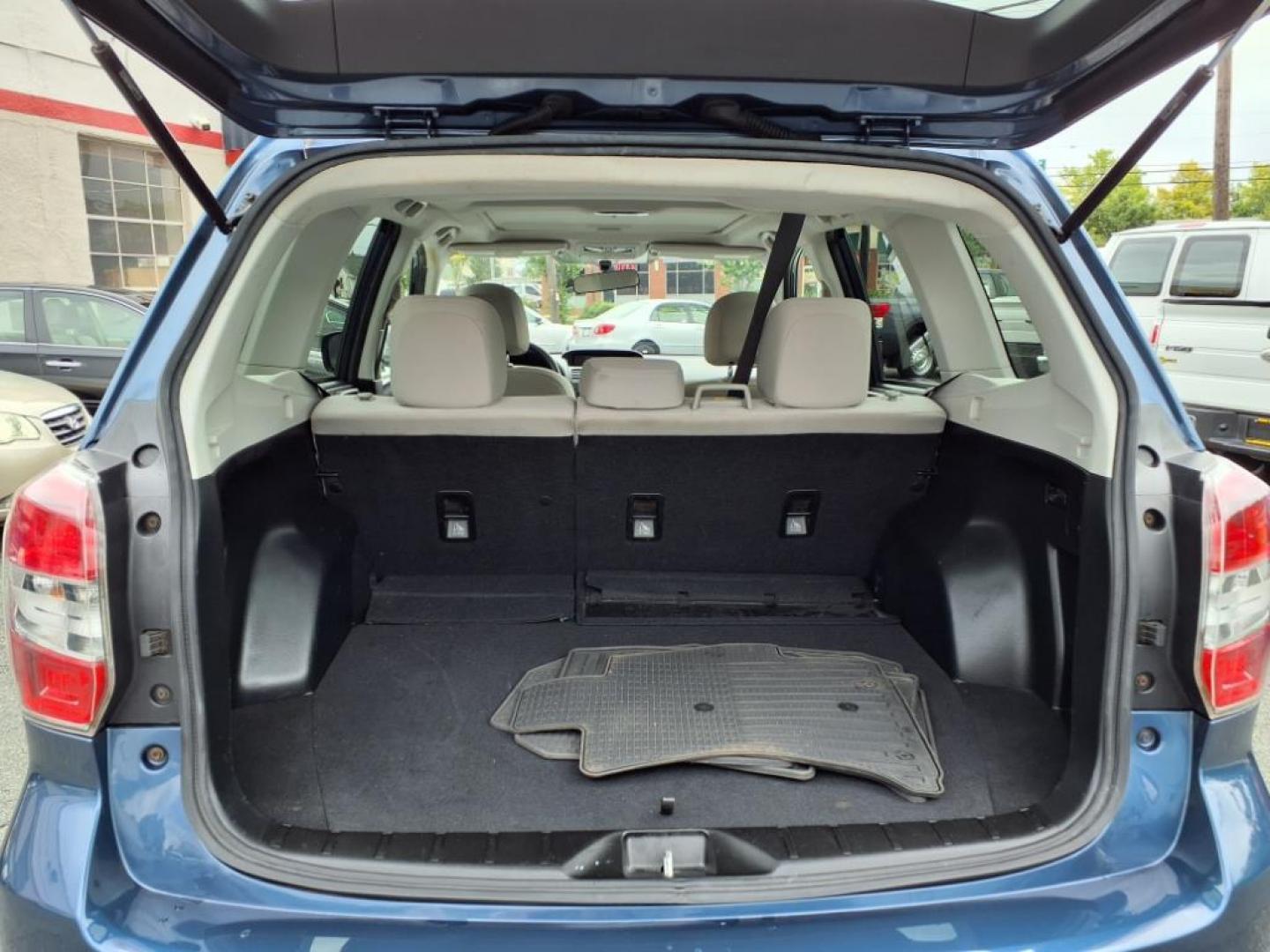 2014 Marine Blue Pearl Subaru Forester 2.5i Premium (JF2SJAEC4EH) with an 2.5L 2.5L H4 170hp 174ft. lbs. Sequential-Port F.I. engine, CVT transmission, located at 50 Eastern Blvd., Essex, MD, 21221, (410) 686-3444, 39.304367, -76.484947 - Photo#4