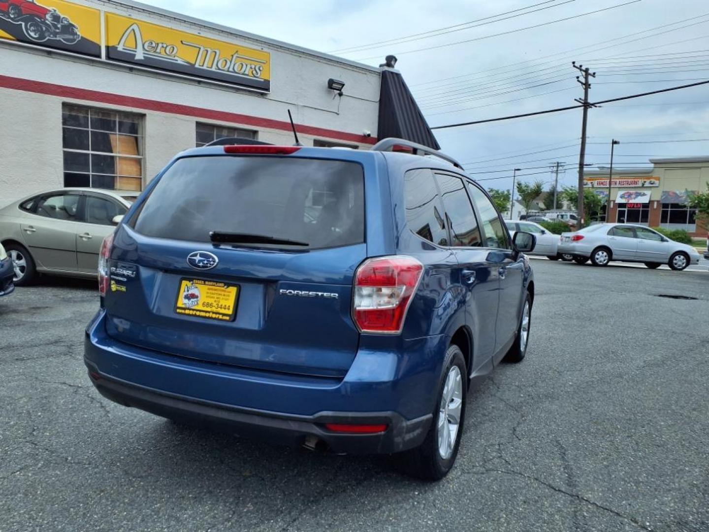 2014 Marine Blue Pearl Subaru Forester 2.5i Premium (JF2SJAEC4EH) with an 2.5L 2.5L H4 170hp 174ft. lbs. Sequential-Port F.I. engine, CVT transmission, located at 50 Eastern Blvd., Essex, MD, 21221, (410) 686-3444, 39.304367, -76.484947 - Photo#5