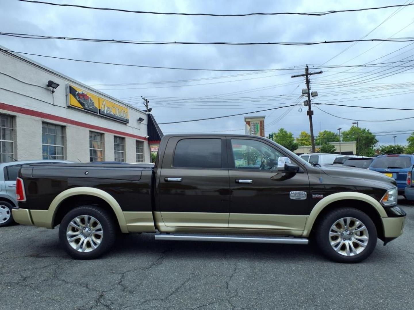 2013 Mineral Gray Metallic Clear Coat RAM 1500 Laramie Longhorn (1C6RR7WT7DS) with an 5.7L HEMI 5.7L V8 395hp 407ft. lbs. Sequential-Port F.I. engine, Automatic transmission, located at 50 Eastern Blvd., Essex, MD, 21221, (410) 686-3444, 39.304367, -76.484947 - Photo#4