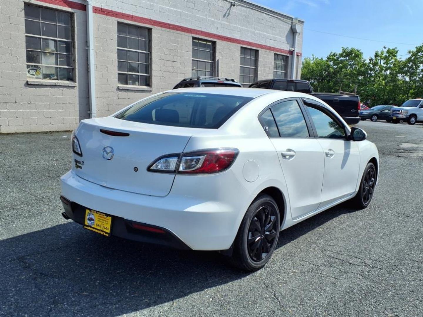 2011 Crystal White Pearl Mazda Mazda3 i Sport (JM1BL1UG2B1) with an 2.0L 2.0L I4 144hp 132ft. lbs. PZEV Sequential-Port F.I. engine, 5-Speed Automatic with Sportshift Manual 5A transmission, located at 50 Eastern Blvd., Essex, MD, 21221, (410) 686-3444, 39.304367, -76.484947 - Photo#4