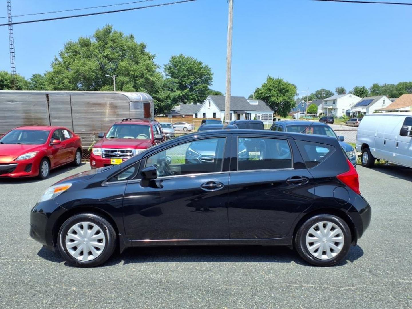 2015 Super Black Nissan Versa Note S Plus (3N1CE2CP1FL) with an 1.6L 4 Cylinder Sequential-Port F.I. engine, 4CYL transmission, located at 50 Eastern Blvd., Essex, MD, 21221, (410) 686-3444, 39.304367, -76.484947 - Photo#1