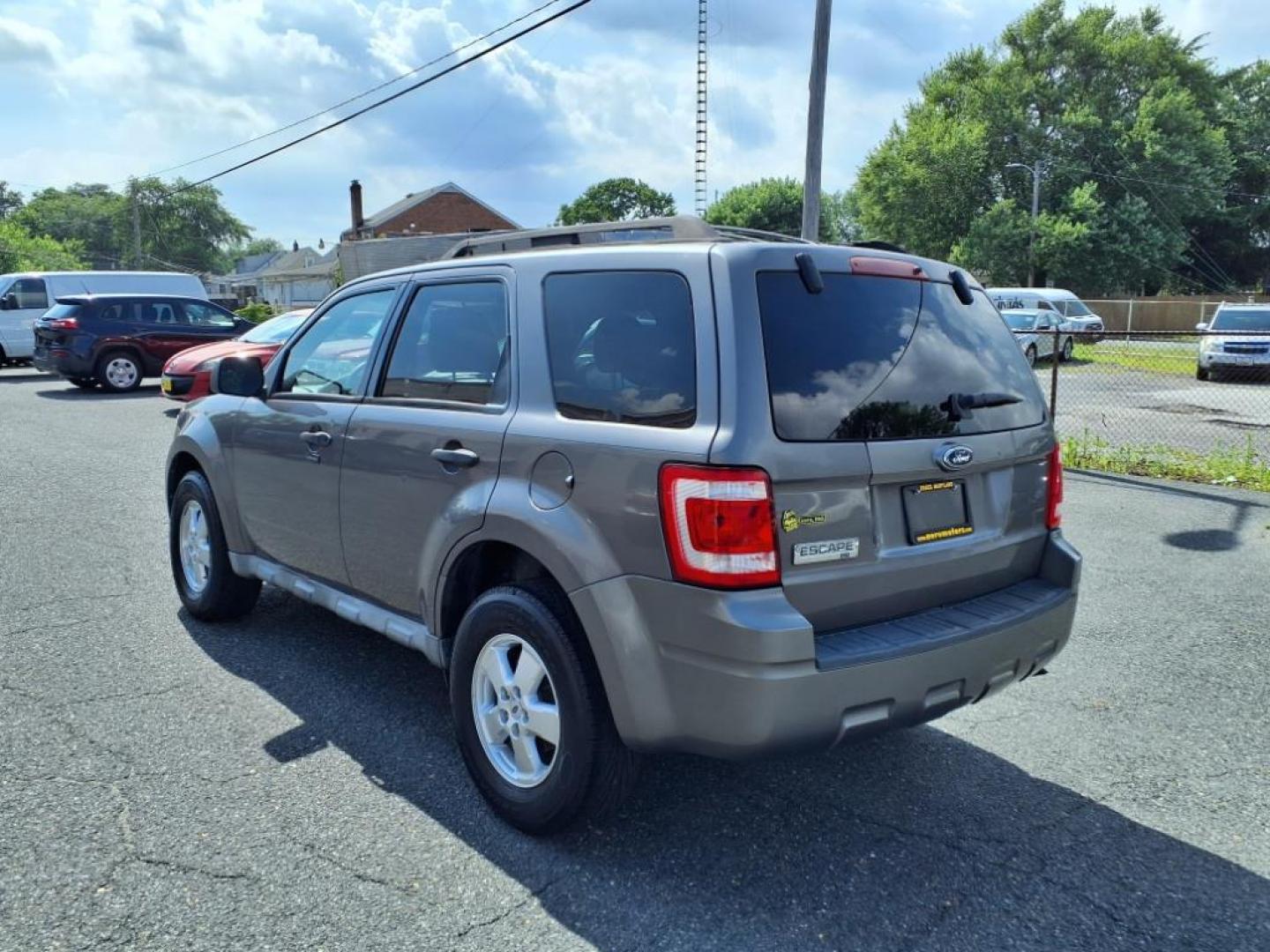 2009 Sterling Gray Clearcoat Metallic Ford Escape XLT (1FMCU03749K) with an 2.5L Duratec 2.5L I4 171hp 171ft. lbs. Sequential-Port F.I. engine, 6-Speed Automatic transmission, located at 50 Eastern Blvd., Essex, MD, 21221, (410) 686-3444, 39.304367, -76.484947 - Photo#2