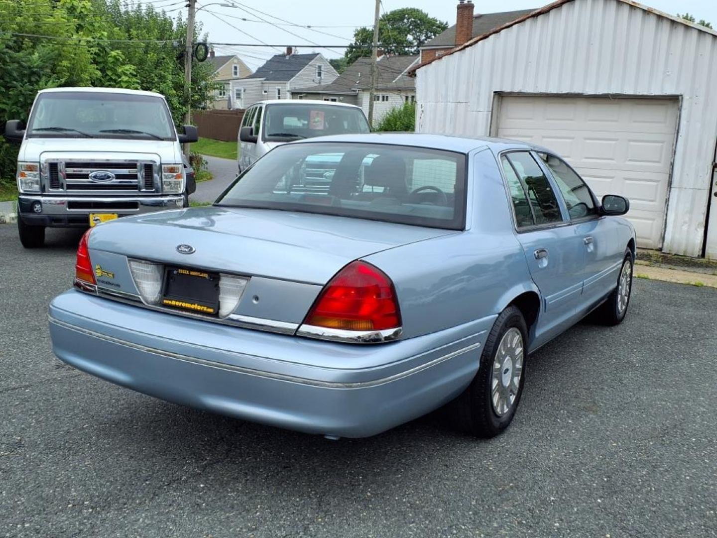 2003 Light Ice Blue Clearcoat Metallic Ford Crown Victoria Base (2FAFP73W03X) with an 4.6L 8 Cylinder Fuel Injected engine, V8 transmission, located at 50 Eastern Blvd., Essex, MD, 21221, (410) 686-3444, 39.304367, -76.484947 - Photo#3