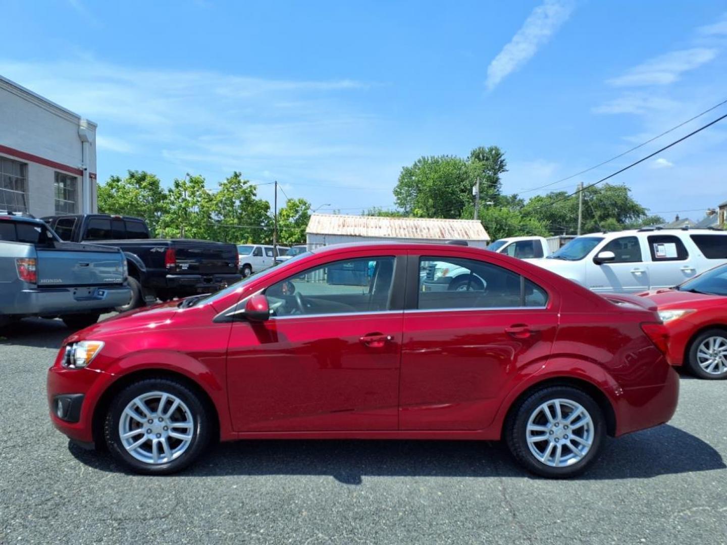 2015 Red Hot Chevrolet Sonic LT Auto (1G1JC5SG6F4) with an 1.8L 4 Cylinder Sequential-Port F.I. engine, AT 4CYL transmission, located at 50 Eastern Blvd., Essex, MD, 21221, (410) 686-3444, 39.304367, -76.484947 - Photo#1