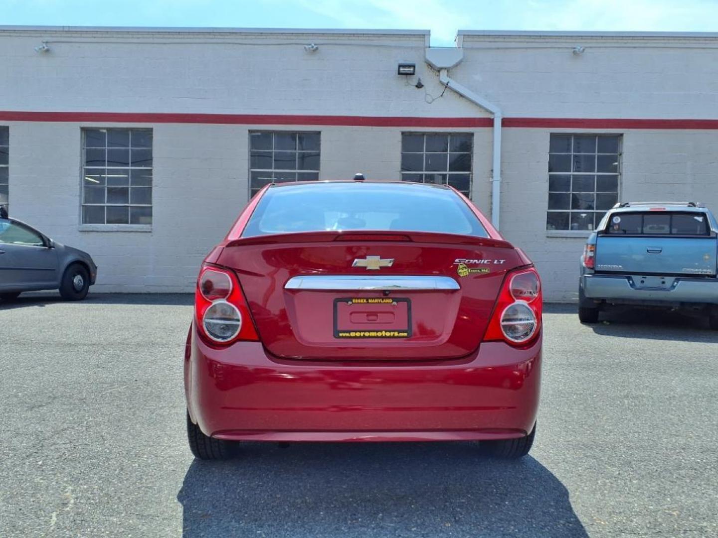 2015 Red Hot Chevrolet Sonic LT Auto (1G1JC5SG6F4) with an 1.8L 4 Cylinder Sequential-Port F.I. engine, AT 4CYL transmission, located at 50 Eastern Blvd., Essex, MD, 21221, (410) 686-3444, 39.304367, -76.484947 - Photo#3