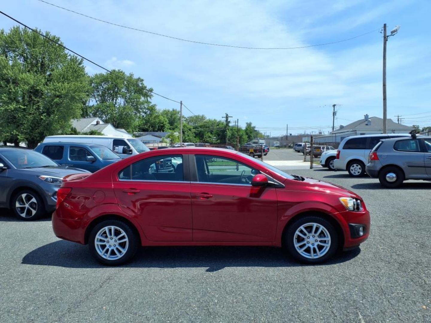 2015 Red Hot Chevrolet Sonic LT Auto (1G1JC5SG6F4) with an 1.8L 4 Cylinder Sequential-Port F.I. engine, AT 4CYL transmission, located at 50 Eastern Blvd., Essex, MD, 21221, (410) 686-3444, 39.304367, -76.484947 - Photo#5