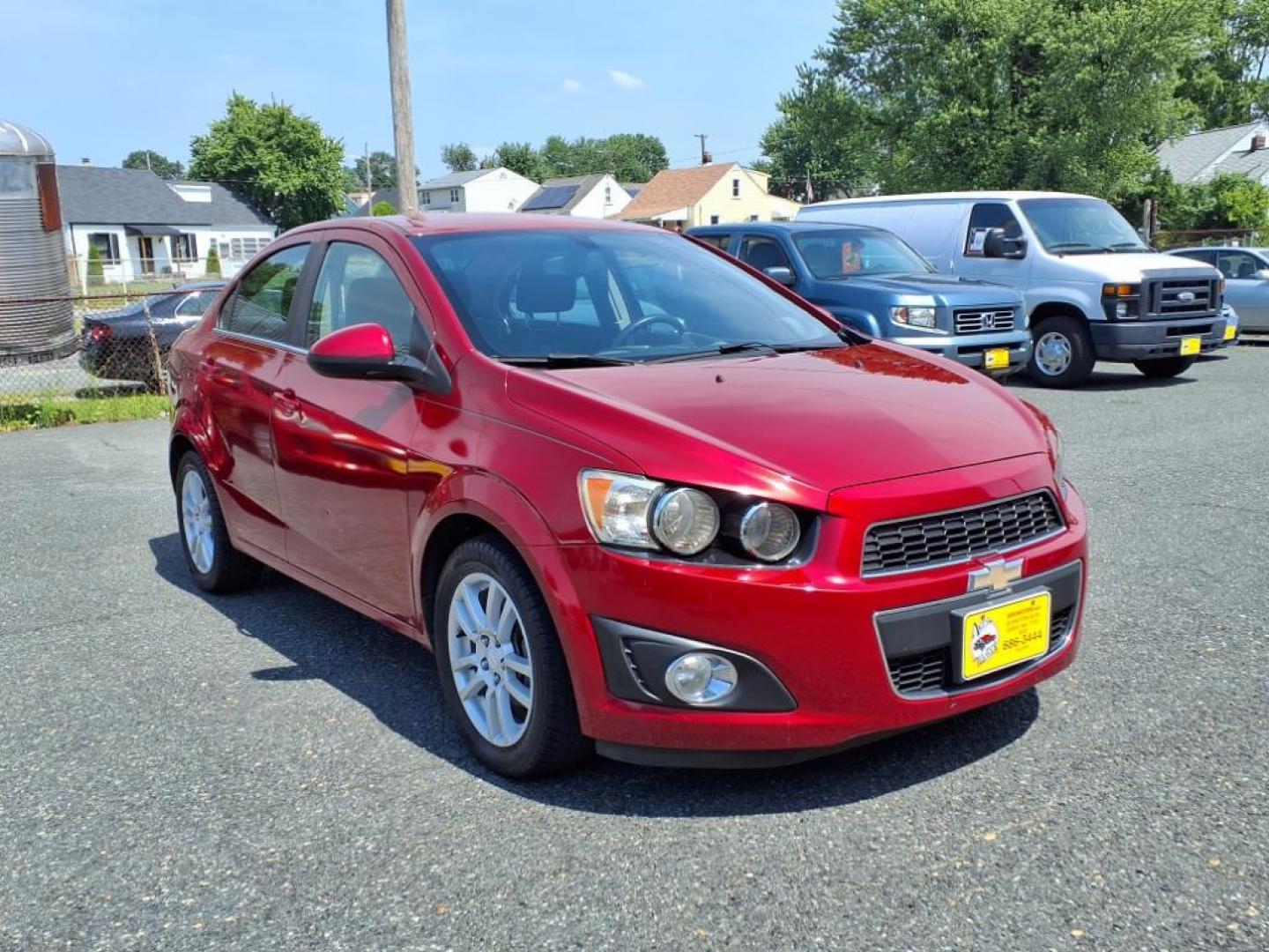 2015 Red Hot Chevrolet Sonic LT Auto (1G1JC5SG6F4) with an 1.8L 4 Cylinder Sequential-Port F.I. engine, AT 4CYL transmission, located at 50 Eastern Blvd., Essex, MD, 21221, (410) 686-3444, 39.304367, -76.484947 - Photo#6