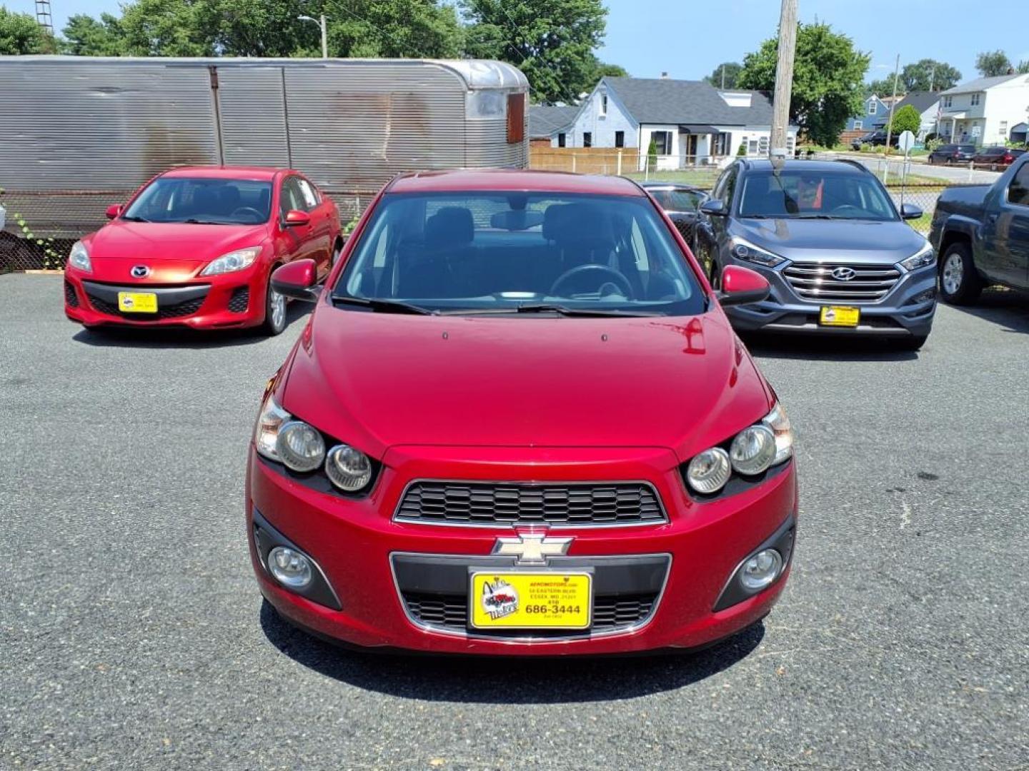 2015 Red Hot Chevrolet Sonic LT Auto (1G1JC5SG6F4) with an 1.8L 4 Cylinder Sequential-Port F.I. engine, AT 4CYL transmission, located at 50 Eastern Blvd., Essex, MD, 21221, (410) 686-3444, 39.304367, -76.484947 - Photo#7
