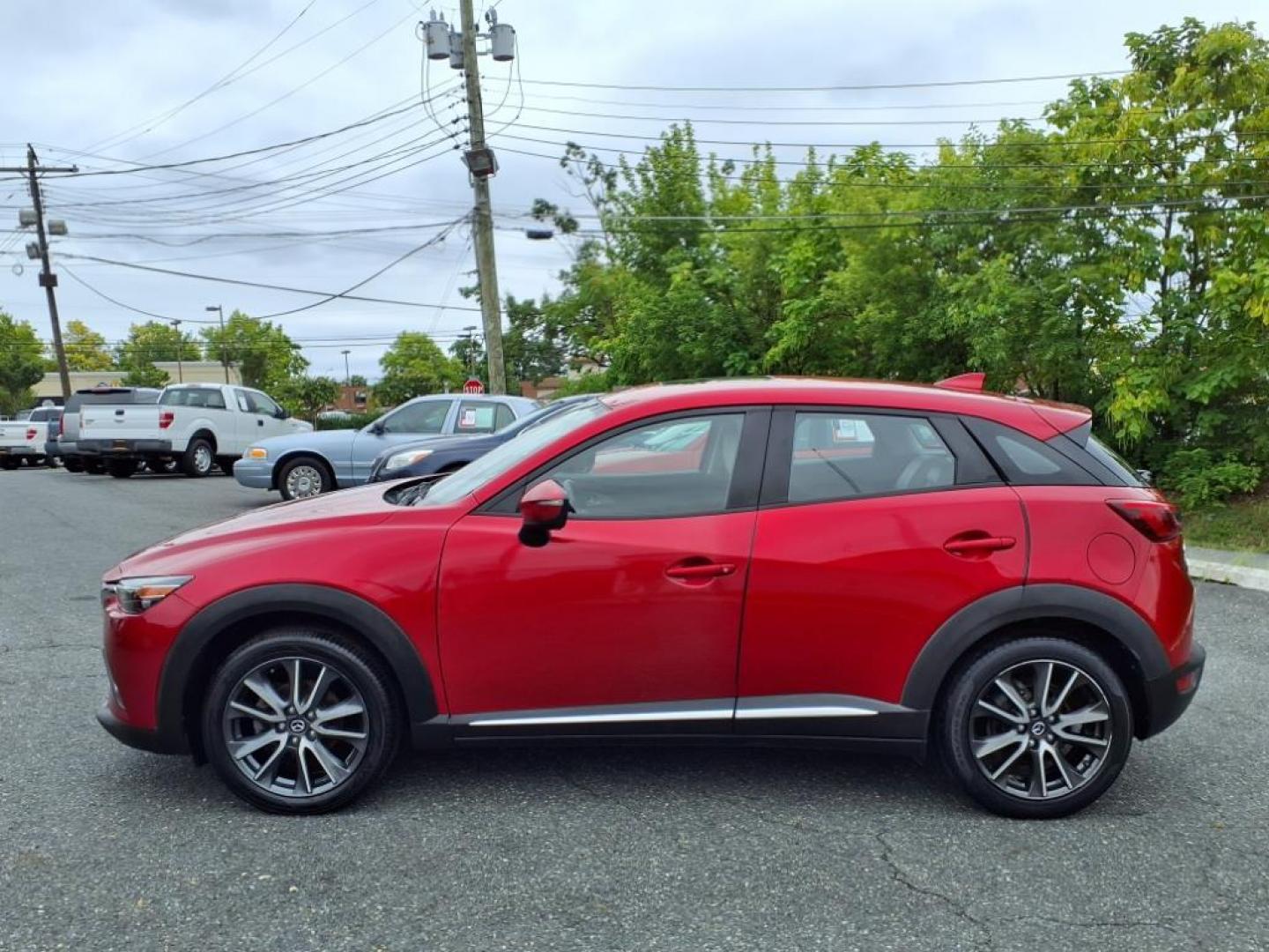 2016 Red Mazda CX-3 Grand Touring (JM1DKBD78G0) with an 2.0L 4 Cylinder Fuel Injected engine, ATAWD transmission, located at 50 Eastern Blvd., Essex, MD, 21221, (410) 686-3444, 39.304367, -76.484947 - Photo#1