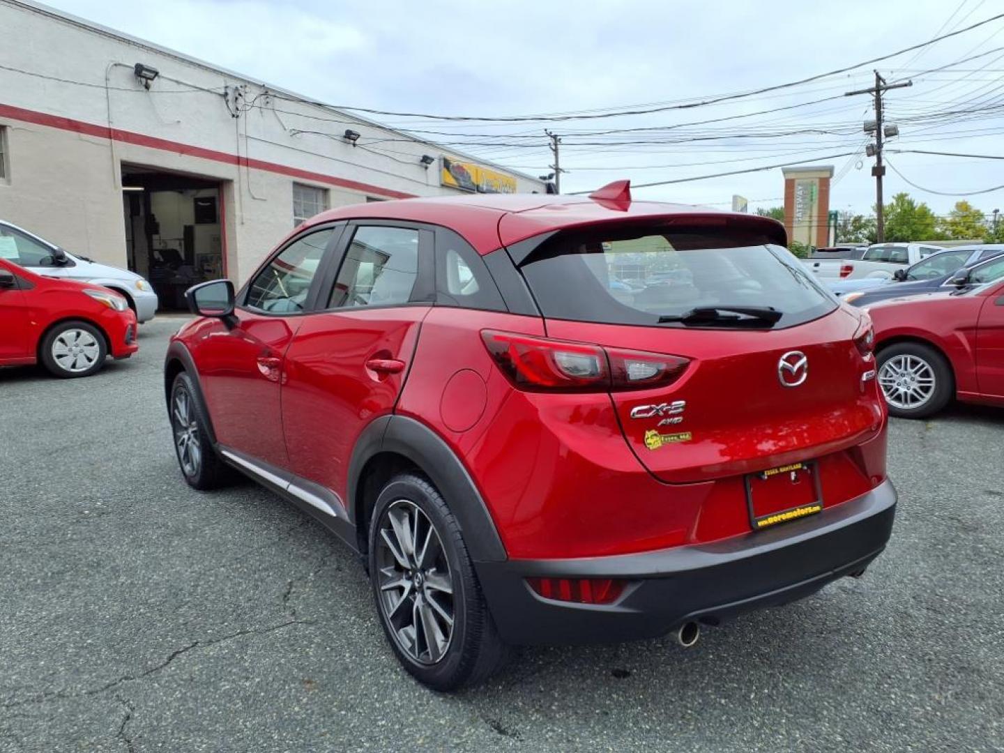 2016 Red Mazda CX-3 Grand Touring (JM1DKBD78G0) with an 2.0L 4 Cylinder Fuel Injected engine, ATAWD transmission, located at 50 Eastern Blvd., Essex, MD, 21221, (410) 686-3444, 39.304367, -76.484947 - Photo#2