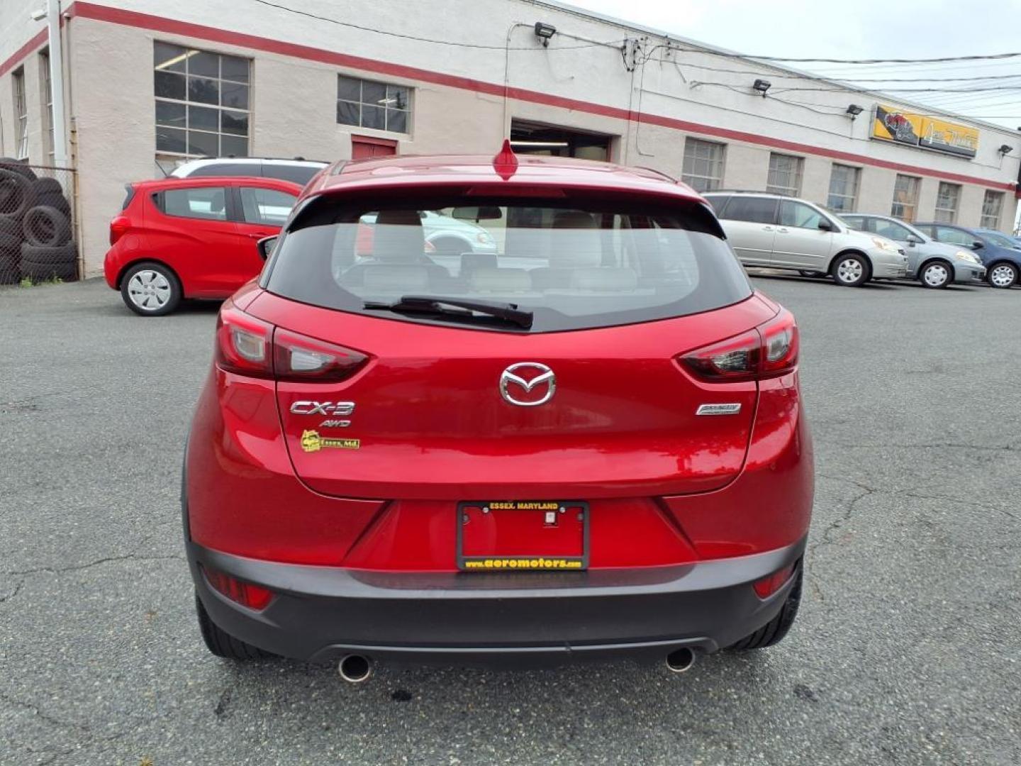 2016 Red Mazda CX-3 Grand Touring (JM1DKBD78G0) with an 2.0L 4 Cylinder Fuel Injected engine, ATAWD transmission, located at 50 Eastern Blvd., Essex, MD, 21221, (410) 686-3444, 39.304367, -76.484947 - Photo#3