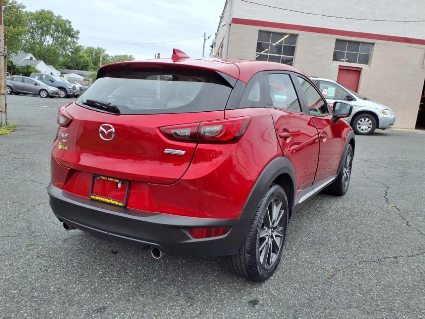 2016 Red Mazda CX-3 Grand Touring (JM1DKBD78G0) with an 2.0L 4 Cylinder Fuel Injected engine, ATAWD transmission, located at 50 Eastern Blvd., Essex, MD, 21221, (410) 686-3444, 39.304367, -76.484947 - Photo#5