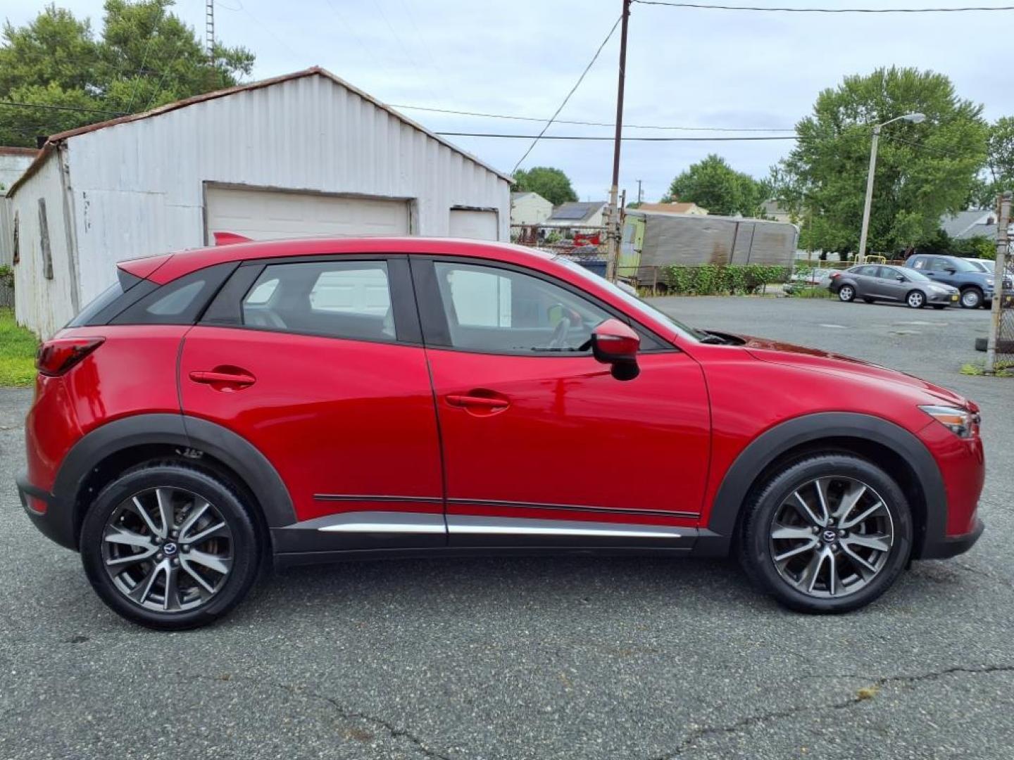 2016 Red Mazda CX-3 Grand Touring (JM1DKBD78G0) with an 2.0L 4 Cylinder Fuel Injected engine, ATAWD transmission, located at 50 Eastern Blvd., Essex, MD, 21221, (410) 686-3444, 39.304367, -76.484947 - Photo#6