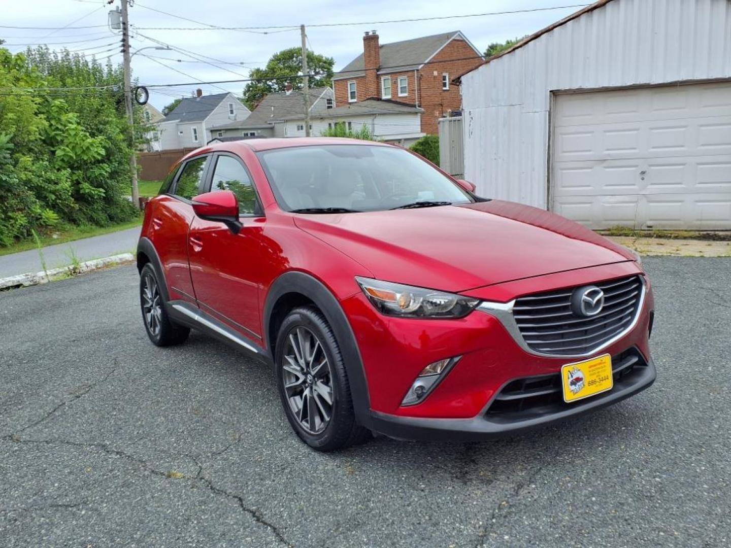 2016 Red Mazda CX-3 Grand Touring (JM1DKBD78G0) with an 2.0L 4 Cylinder Fuel Injected engine, ATAWD transmission, located at 50 Eastern Blvd., Essex, MD, 21221, (410) 686-3444, 39.304367, -76.484947 - Photo#7