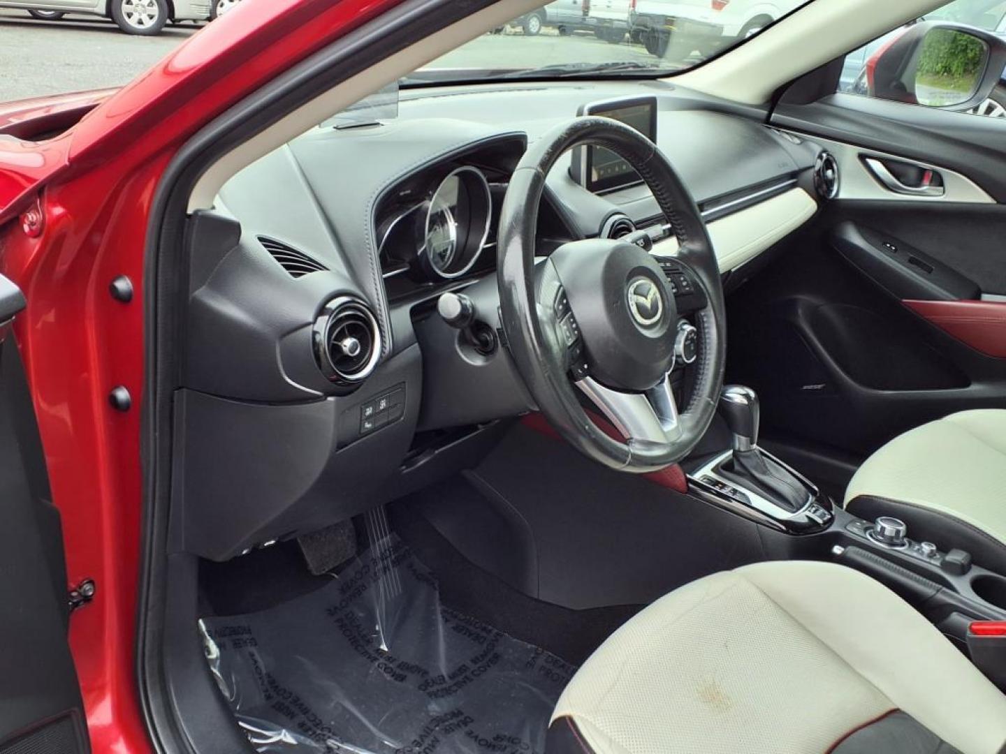 2016 Red Mazda CX-3 Grand Touring (JM1DKBD78G0) with an 2.0L 4 Cylinder Fuel Injected engine, ATAWD transmission, located at 50 Eastern Blvd., Essex, MD, 21221, (410) 686-3444, 39.304367, -76.484947 - Photo#11