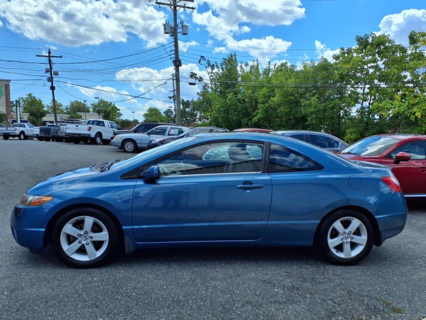 2006 Atomic Blue Metallic Honda Civic EX (2HGFG12876H) with an 1.8L 1L NA I4 single overhead cam (SOHC) 16V Fuel Injected engine, 5-Speed Automatic transmission, located at 50 Eastern Blvd., Essex, MD, 21221, (410) 686-3444, 39.304367, -76.484947 - Photo#1
