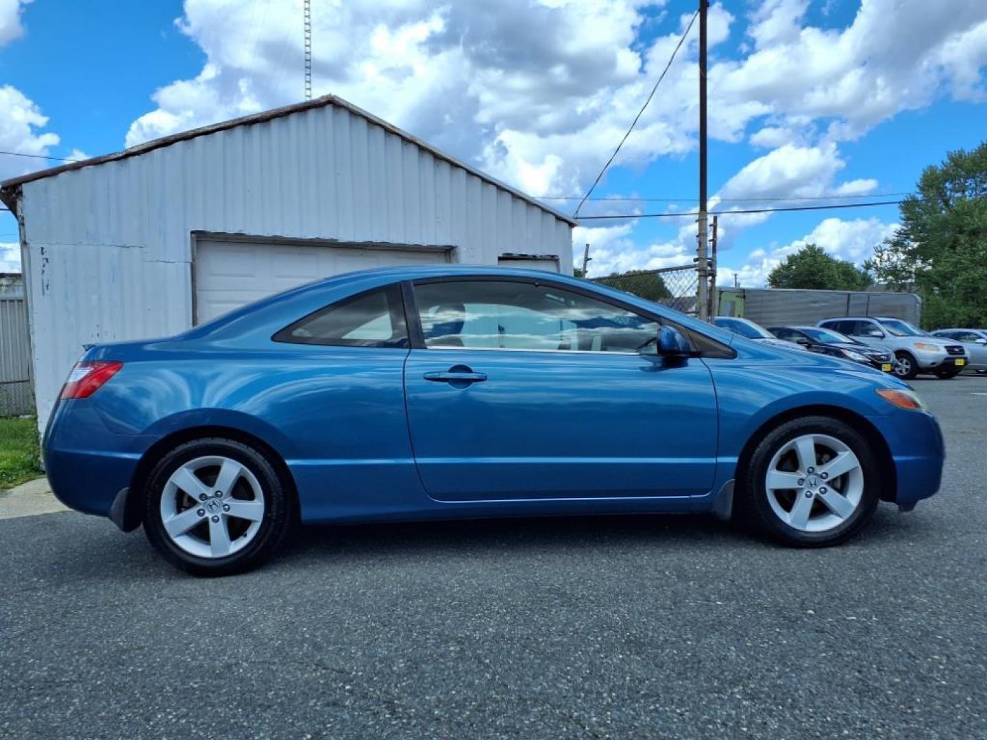 2006 Atomic Blue Metallic Honda Civic EX (2HGFG12876H) with an 1.8L 1L NA I4 single overhead cam (SOHC) 16V Fuel Injected engine, 5-Speed Automatic transmission, located at 50 Eastern Blvd., Essex, MD, 21221, (410) 686-3444, 39.304367, -76.484947 - Photo#5