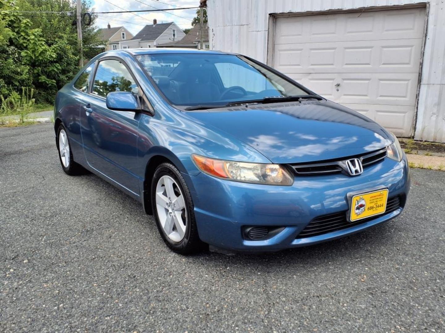 2006 Atomic Blue Metallic Honda Civic EX (2HGFG12876H) with an 1.8L 1L NA I4 single overhead cam (SOHC) 16V Fuel Injected engine, 5-Speed Automatic transmission, located at 50 Eastern Blvd., Essex, MD, 21221, (410) 686-3444, 39.304367, -76.484947 - Photo#6