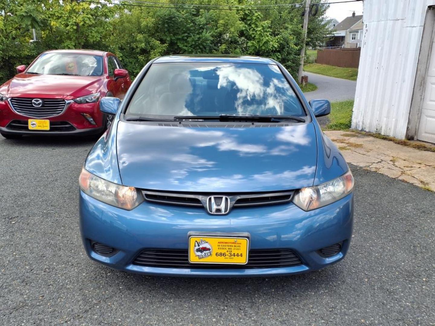 2006 Atomic Blue Metallic Honda Civic EX (2HGFG12876H) with an 1.8L 1L NA I4 single overhead cam (SOHC) 16V Fuel Injected engine, 5-Speed Automatic transmission, located at 50 Eastern Blvd., Essex, MD, 21221, (410) 686-3444, 39.304367, -76.484947 - Photo#7