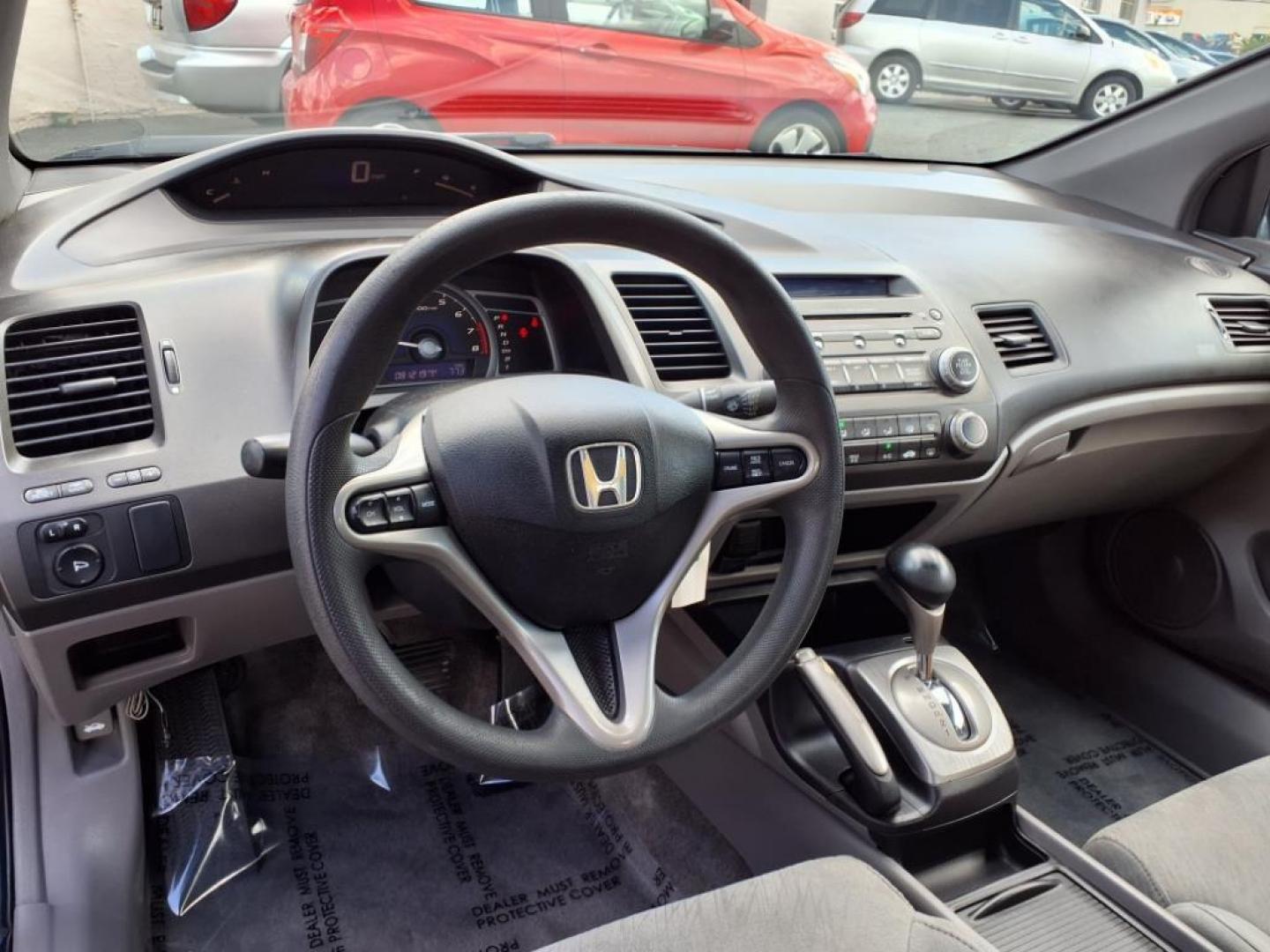 2006 Atomic Blue Metallic Honda Civic EX (2HGFG12876H) with an 1.8L 1L NA I4 single overhead cam (SOHC) 16V Fuel Injected engine, 5-Speed Automatic transmission, located at 50 Eastern Blvd., Essex, MD, 21221, (410) 686-3444, 39.304367, -76.484947 - Photo#13