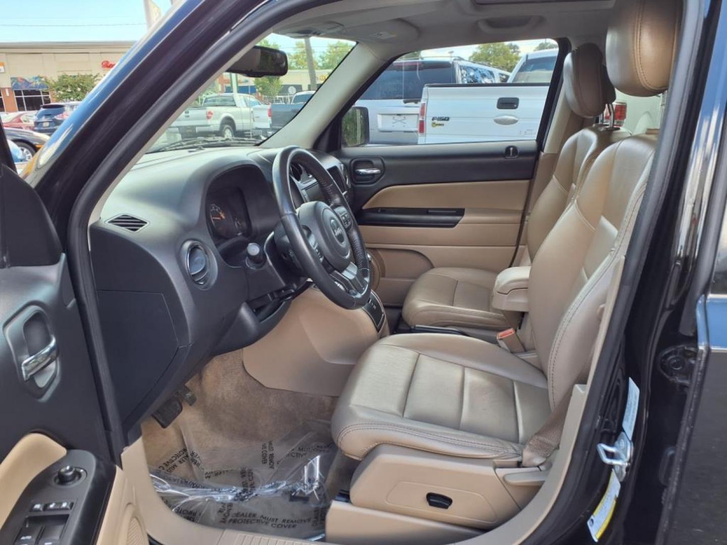 2016 Black Clear Coat Jeep Patriot High Altitude (1C4NJRFB3GD) with an 2.4L 4 Cylinder Sequential-Port F.I. engine, AWD transmission, located at 50 Eastern Blvd., Essex, MD, 21221, (410) 686-3444, 39.304367, -76.484947 - Photo#11