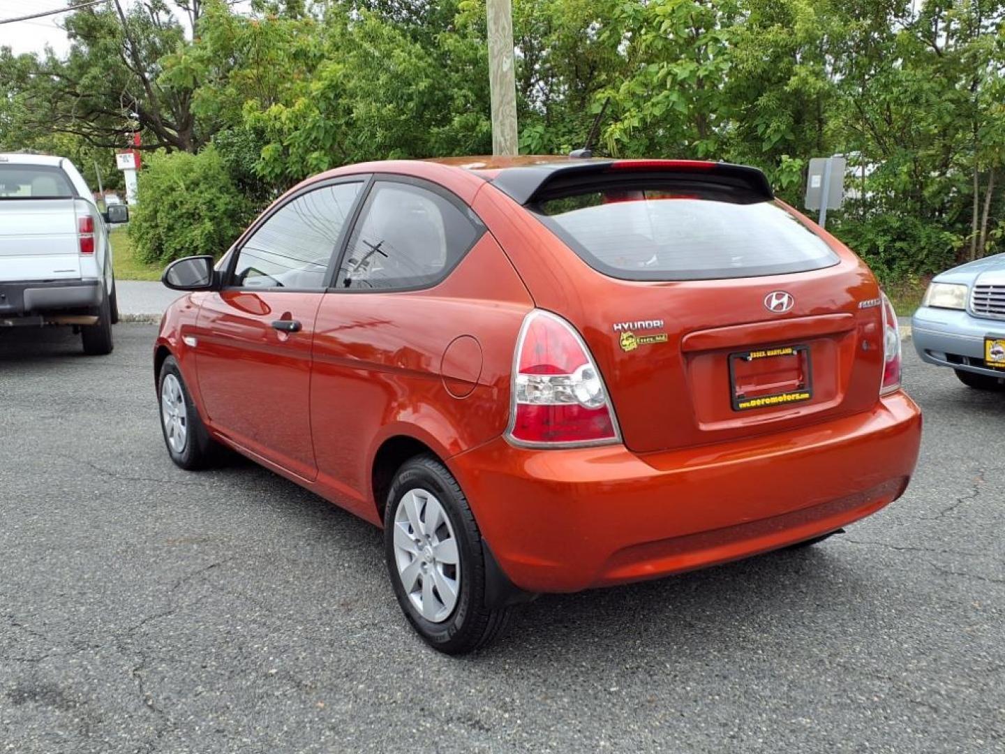 2009 Tango Red Hyundai ACCENT GS (KMHCM36C29U) with an 1.6L 4 Cylinder Sequential-Port F.I. engine, 4CYL transmission, located at 50 Eastern Blvd., Essex, MD, 21221, (410) 686-3444, 39.304367, -76.484947 - Photo#2
