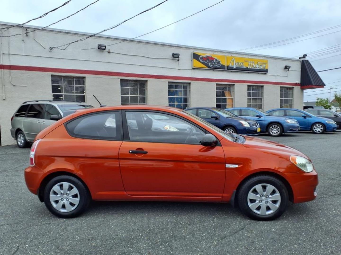 2009 Tango Red Hyundai ACCENT GS (KMHCM36C29U) with an 1.6L 4 Cylinder Sequential-Port F.I. engine, 4CYL transmission, located at 50 Eastern Blvd., Essex, MD, 21221, (410) 686-3444, 39.304367, -76.484947 - Photo#6