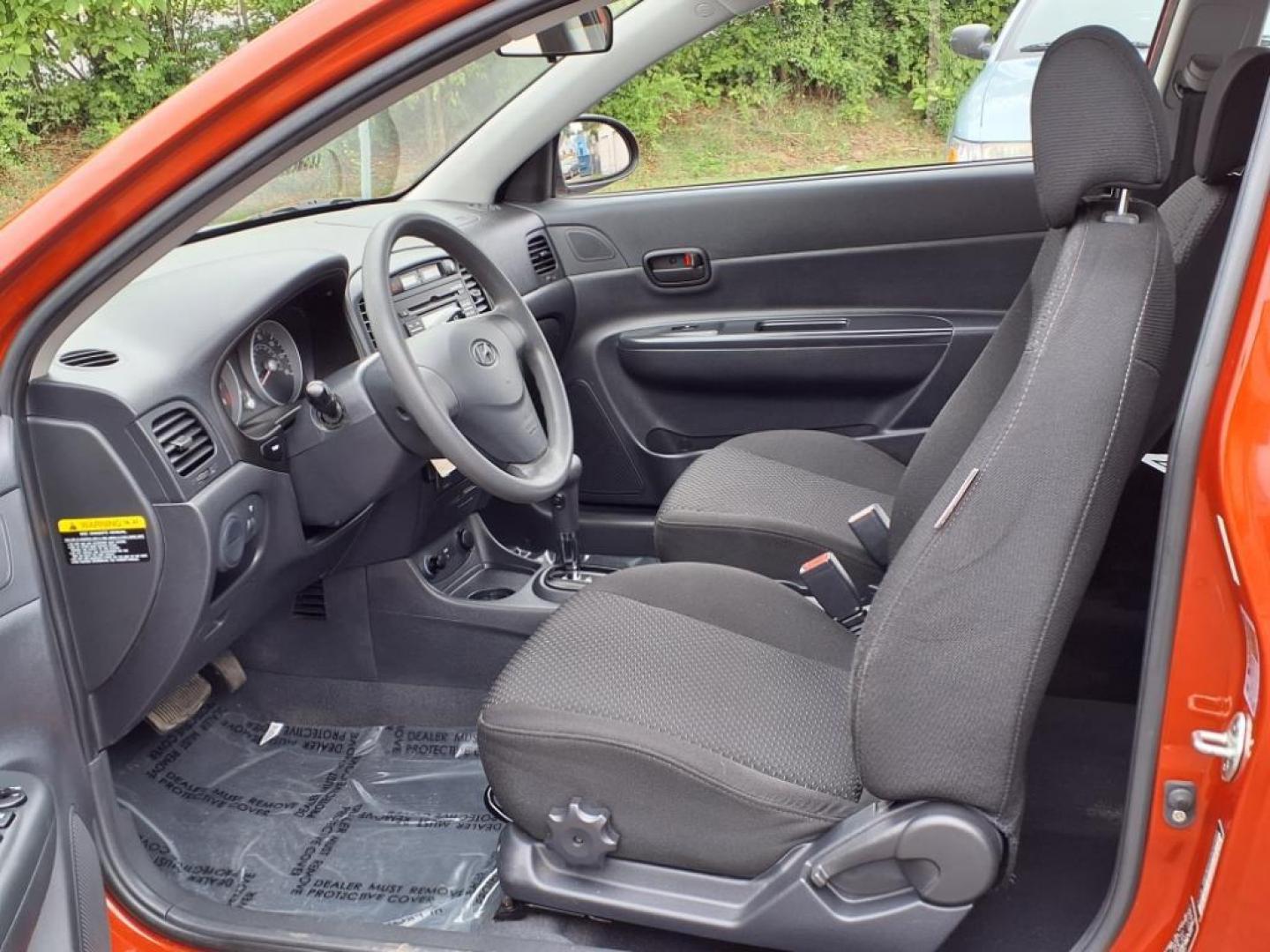 2009 Tango Red Hyundai ACCENT GS (KMHCM36C29U) with an 1.6L 4 Cylinder Sequential-Port F.I. engine, 4CYL transmission, located at 50 Eastern Blvd., Essex, MD, 21221, (410) 686-3444, 39.304367, -76.484947 - Photo#12