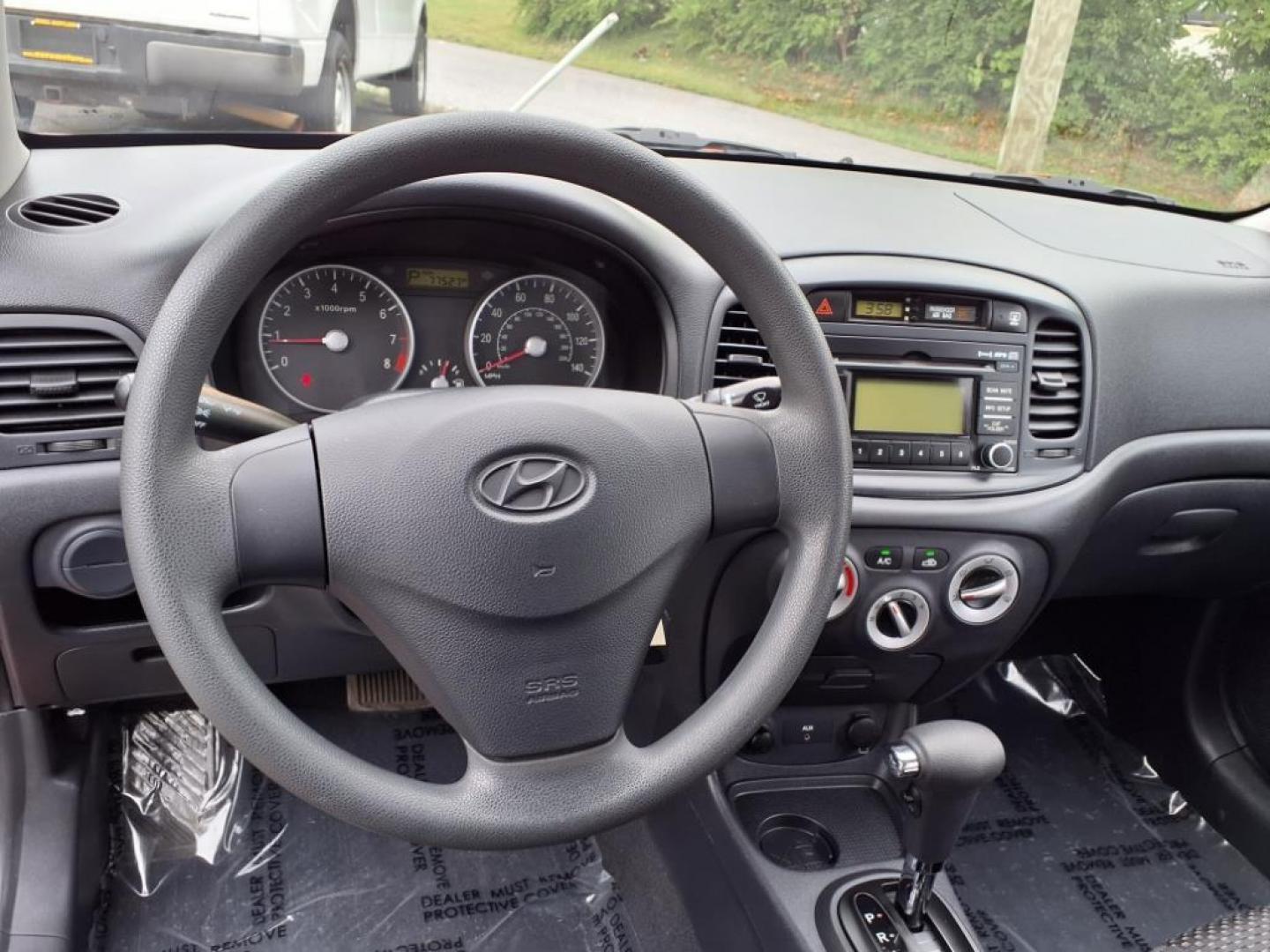 2009 Tango Red Hyundai ACCENT GS (KMHCM36C29U) with an 1.6L 4 Cylinder Sequential-Port F.I. engine, 4CYL transmission, located at 50 Eastern Blvd., Essex, MD, 21221, (410) 686-3444, 39.304367, -76.484947 - Photo#14