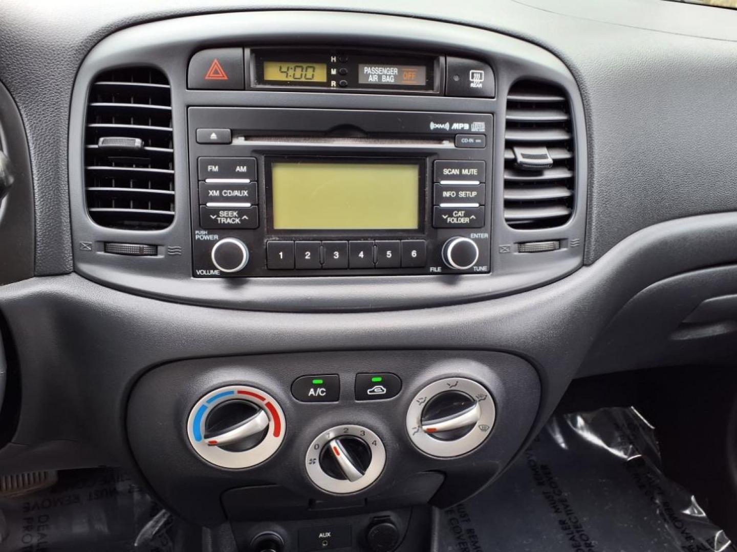 2009 Tango Red Hyundai ACCENT GS (KMHCM36C29U) with an 1.6L 4 Cylinder Sequential-Port F.I. engine, 4CYL transmission, located at 50 Eastern Blvd., Essex, MD, 21221, (410) 686-3444, 39.304367, -76.484947 - Photo#17
