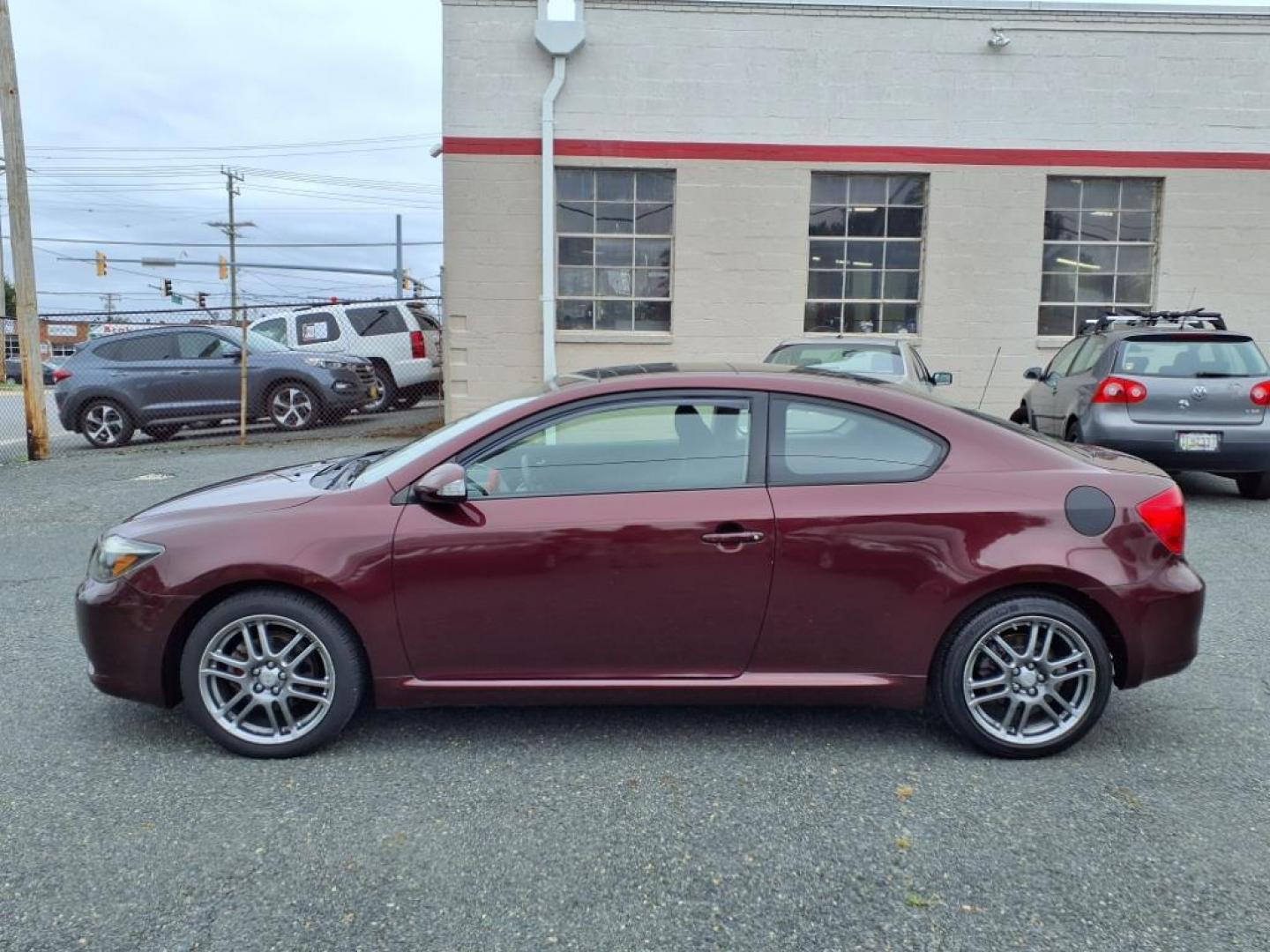 2007 Black Cherry Pearl Scion tC Base (JTKDE167870) with an 2.4L 2.4L I4 161hp 162ft. lbs. Fuel Injected engine, 4-Speed Automatic transmission, located at 50 Eastern Blvd., Essex, MD, 21221, (410) 686-3444, 39.304367, -76.484947 - Photo#1