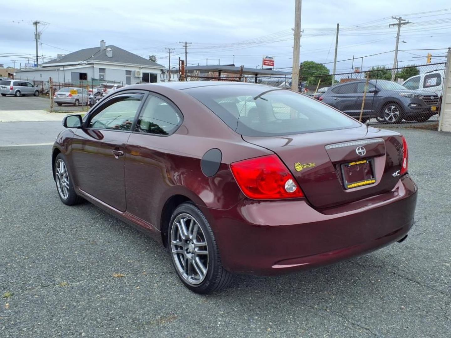 2007 Black Cherry Pearl Scion tC Base (JTKDE167870) with an 2.4L 2.4L I4 161hp 162ft. lbs. Fuel Injected engine, 4-Speed Automatic transmission, located at 50 Eastern Blvd., Essex, MD, 21221, (410) 686-3444, 39.304367, -76.484947 - Photo#2