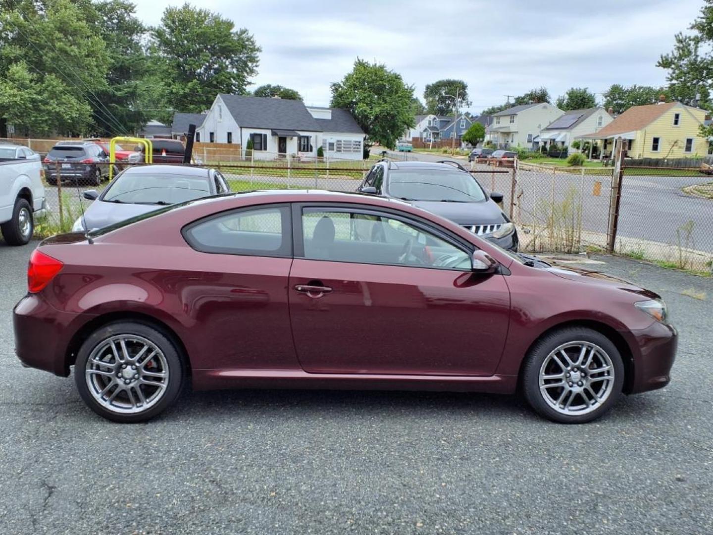 2007 Black Cherry Pearl Scion tC Base (JTKDE167870) with an 2.4L 2.4L I4 161hp 162ft. lbs. Fuel Injected engine, 4-Speed Automatic transmission, located at 50 Eastern Blvd., Essex, MD, 21221, (410) 686-3444, 39.304367, -76.484947 - Photo#5