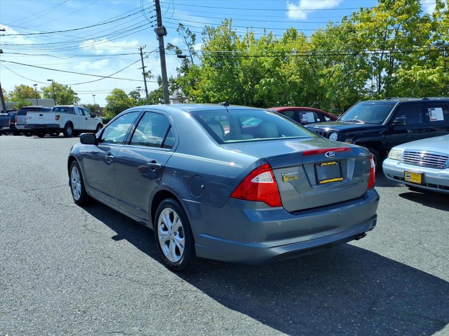 2012 Steel Blue Metallic Ford Fusion SE (3FAHP0HA9CR) with an 2.5L 4 Cylinder Sequential-Port F.I. engine, 4CYL transmission, located at 50 Eastern Blvd., Essex, MD, 21221, (410) 686-3444, 39.304367, -76.484947 - Photo#2
