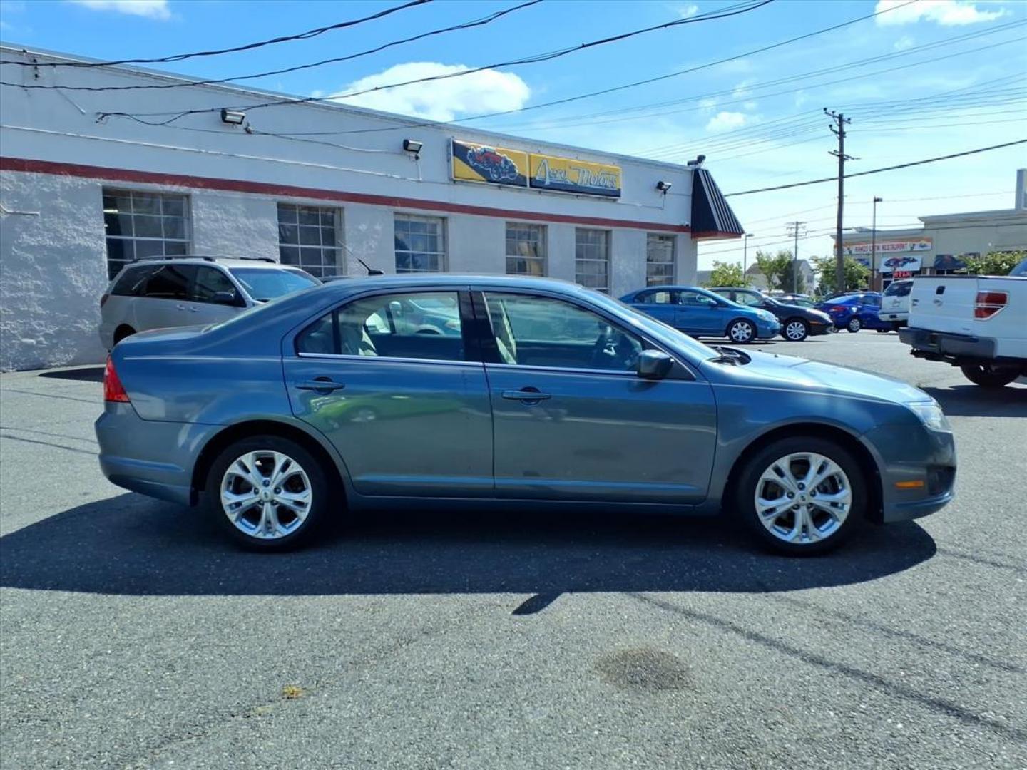 2012 Steel Blue Metallic Ford Fusion SE (3FAHP0HA9CR) with an 2.5L 4 Cylinder Sequential-Port F.I. engine, 4CYL transmission, located at 50 Eastern Blvd., Essex, MD, 21221, (410) 686-3444, 39.304367, -76.484947 - Photo#5