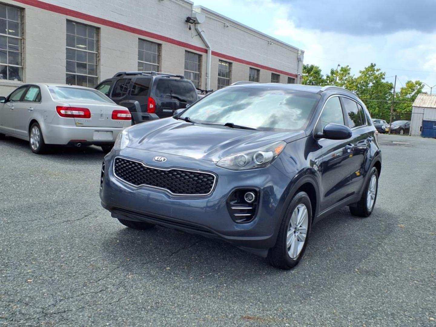 2019 Pacific Blue Kia Sportage LX (KNDPMCAC7K7) with an 2.4L 4 Cylinder Fuel Injected engine, 4CYL AWD transmission, located at 50 Eastern Blvd., Essex, MD, 21221, (410) 686-3444, 39.304367, -76.484947 - Photo#0