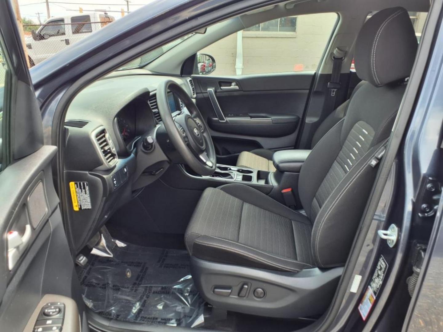 2019 Pacific Blue Kia Sportage LX (KNDPMCAC7K7) with an 2.4L 4 Cylinder Fuel Injected engine, 4CYL AWD transmission, located at 50 Eastern Blvd., Essex, MD, 21221, (410) 686-3444, 39.304367, -76.484947 - Photo#12