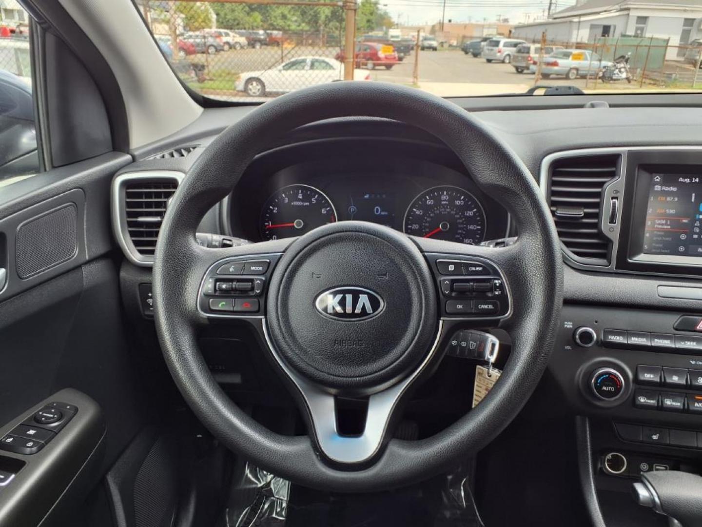 2019 Pacific Blue Kia Sportage LX (KNDPMCAC7K7) with an 2.4L 4 Cylinder Fuel Injected engine, 4CYL AWD transmission, located at 50 Eastern Blvd., Essex, MD, 21221, (410) 686-3444, 39.304367, -76.484947 - Photo#14