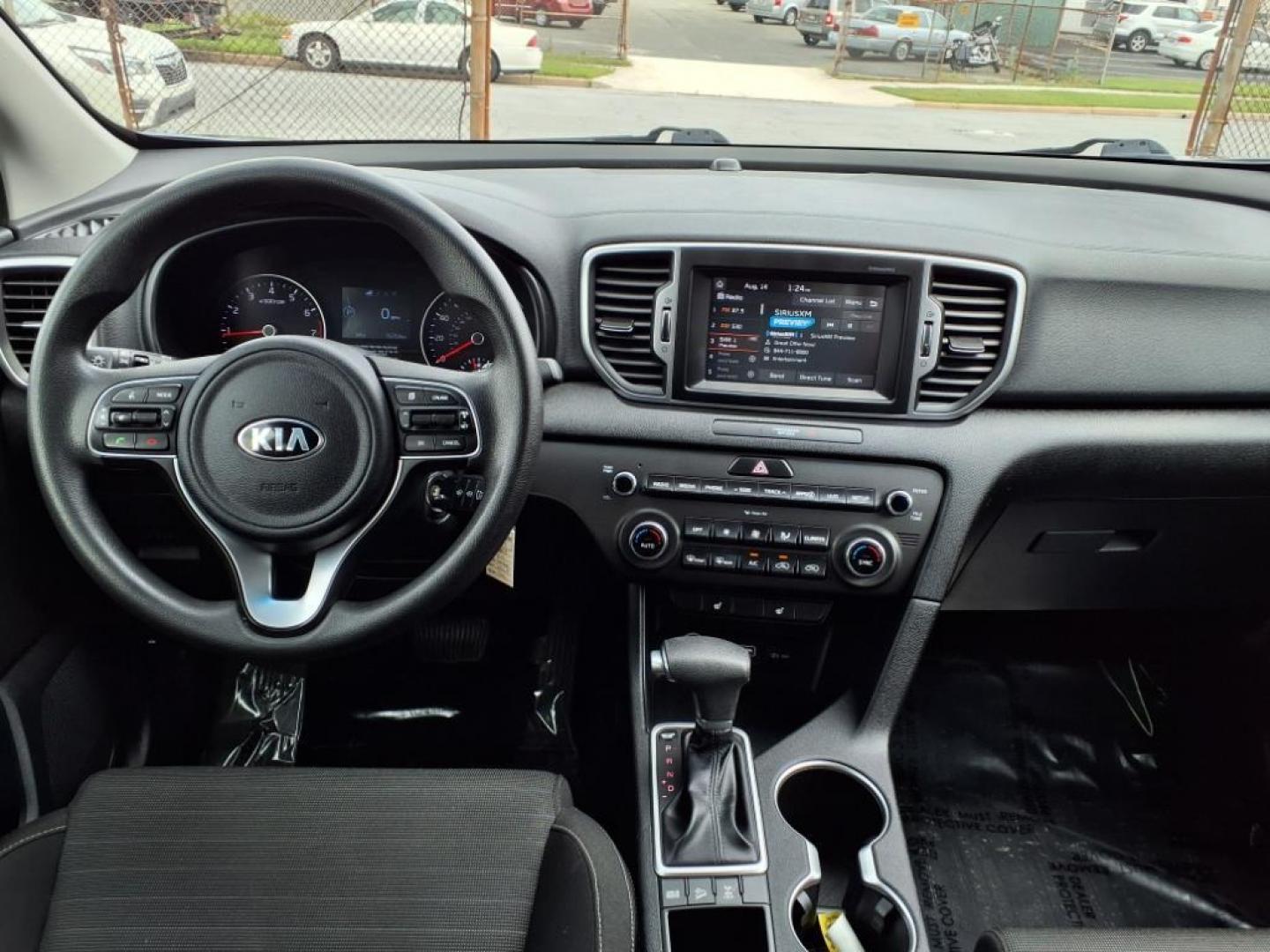 2019 Pacific Blue Kia Sportage LX (KNDPMCAC7K7) with an 2.4L 4 Cylinder Fuel Injected engine, 4CYL AWD transmission, located at 50 Eastern Blvd., Essex, MD, 21221, (410) 686-3444, 39.304367, -76.484947 - Photo#15