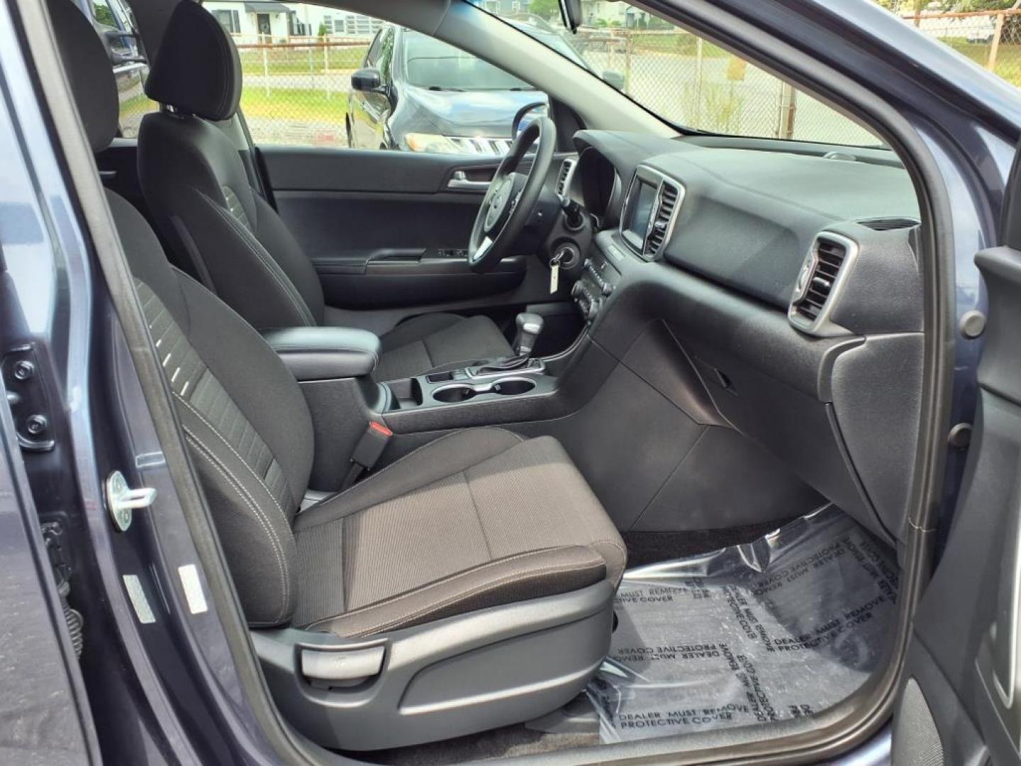 2019 Pacific Blue Kia Sportage LX (KNDPMCAC7K7) with an 2.4L 4 Cylinder Fuel Injected engine, 4CYL AWD transmission, located at 50 Eastern Blvd., Essex, MD, 21221, (410) 686-3444, 39.304367, -76.484947 - Photo#17