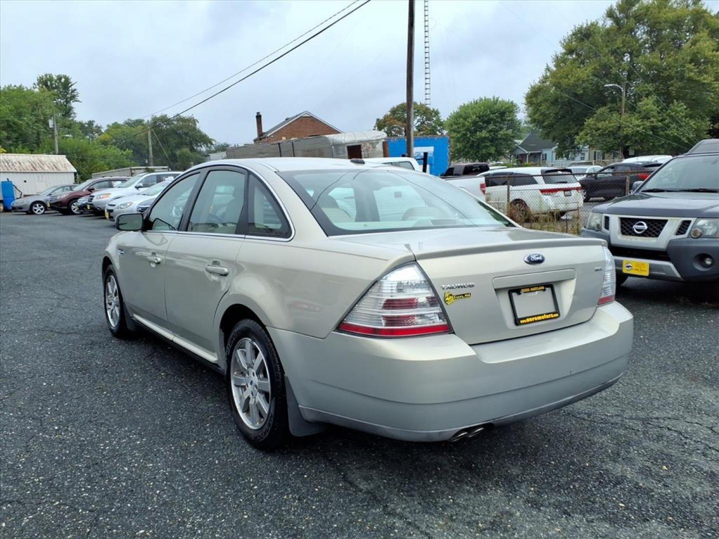 2009 Smokestone Clearcoat Metallic Ford Taurus SEL (1FAHP24W29G) with an 3.5L 6 Cylinder Sequential-Port F.I. engine, V6 transmission, located at 50 Eastern Blvd., Essex, MD, 21221, (410) 686-3444, 39.304367, -76.484947 - Photo#2