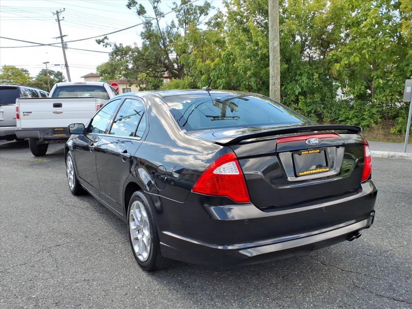 2011 Black Ford Fusion SE (3FAHP0HA4BR) with an 2.5L 4 Cylinder Sequential-Port F.I. engine, Automatic transmission, located at 50 Eastern Blvd., Essex, MD, 21221, (410) 686-3444, 39.304367, -76.484947 - Photo#1