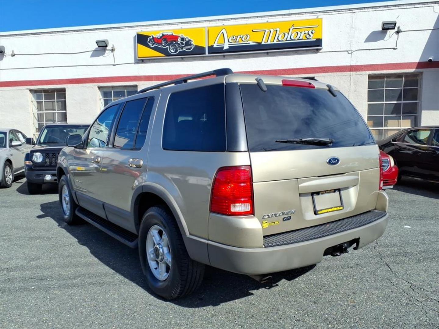2002 Harvest Gold Clearcoat Metallic Ford Explorer XLT (1FMZU63EX2U) with an 4.0L 4.0L V6 210hp 254ft. lbs. Fuel Injected engine, 5-Speed Automatic transmission, located at 50 Eastern Blvd., Essex, MD, 21221, (410) 686-3444, 39.304367, -76.484947 - Photo#2