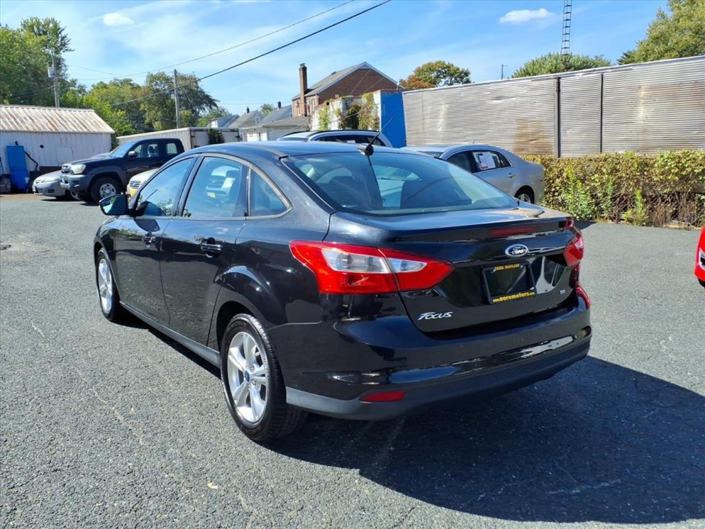 2013 Tuxedo Black Metallic Ford Focus SE (1FADP3F20DL) with an 2.0L 4 Cylinder Fuel Injected engine, 4CYL AT transmission, located at 50 Eastern Blvd., Essex, MD, 21221, (410) 686-3444, 39.304367, -76.484947 - Photo#2