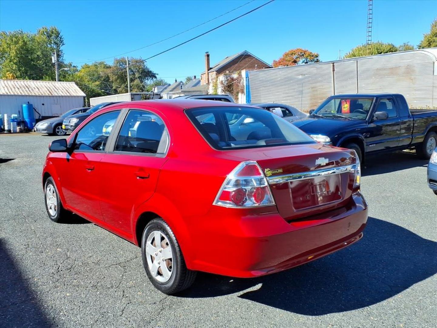 2009 Sport Red Chevrolet Aveo LS (KL1TD56E89B) with an 1.6L ECOTEC 1.6L I4 106hp 105ft. lbs. Sequential-Port F.I. engine, 5-Speed Manual transmission, located at 50 Eastern Blvd., Essex, MD, 21221, (410) 686-3444, 39.304367, -76.484947 - Photo#2