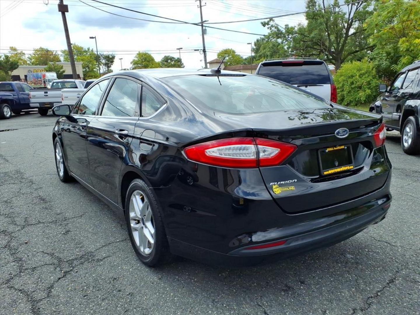 2016 Black Ford Fusion SE (3FA6P0H70GR) with an 2.5L 4 Cylinder Sequential-Port F.I. engine, 4CYL transmission, located at 50 Eastern Blvd., Essex, MD, 21221, (410) 686-3444, 39.304367, -76.484947 - Photo#2