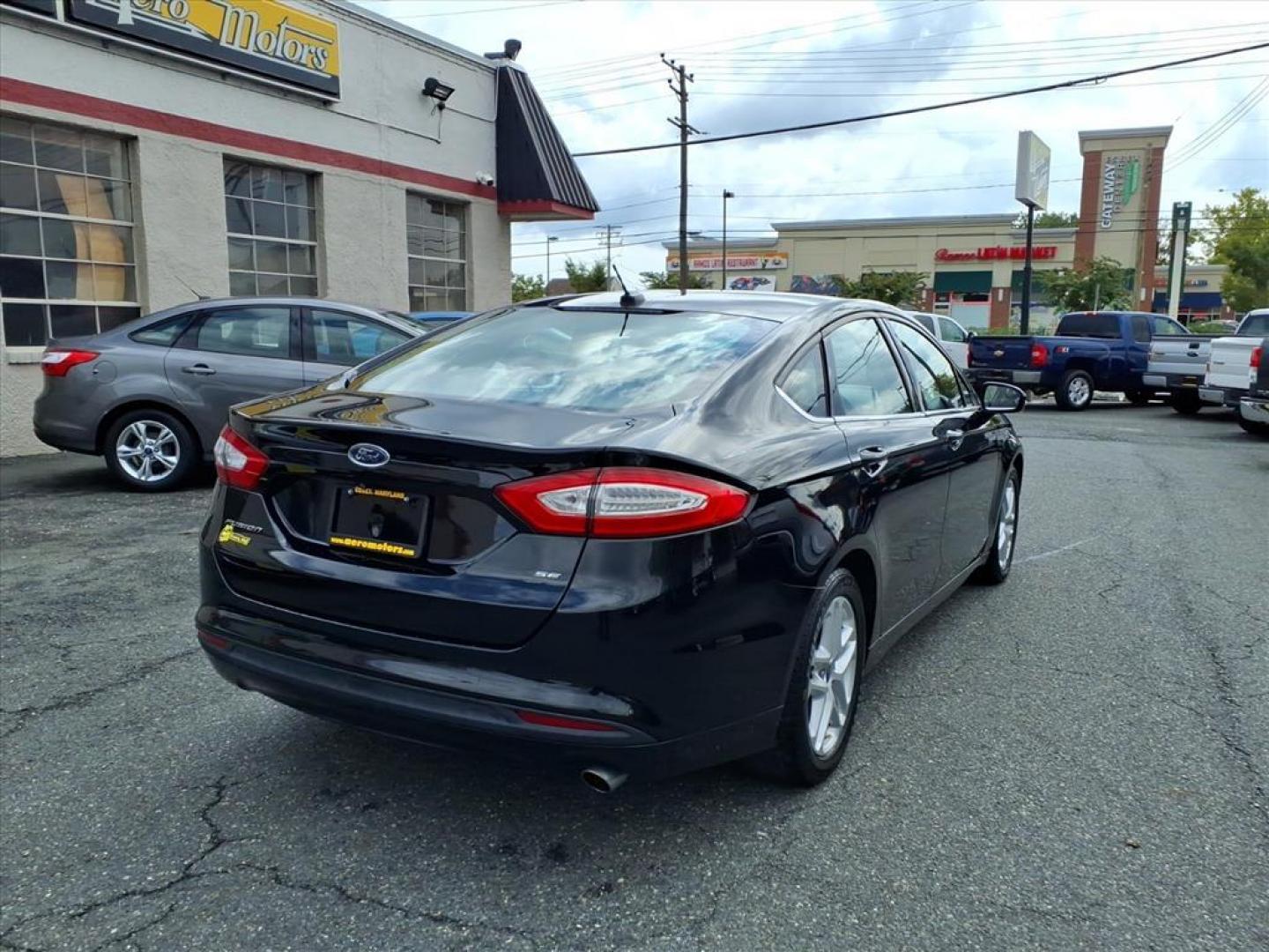 2016 Black Ford Fusion SE (3FA6P0H70GR) with an 2.5L 4 Cylinder Sequential-Port F.I. engine, 4CYL transmission, located at 50 Eastern Blvd., Essex, MD, 21221, (410) 686-3444, 39.304367, -76.484947 - Photo#4