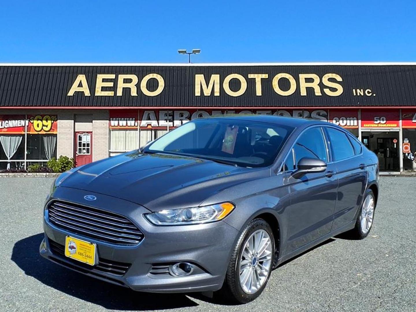 2015 Magnetic Metallic Ford Fusion SE (3FA6P0H91FR) with an 2.0L EcoBoost 2.0L Turbo I4 240hp 270ft. lbs. Turbocharged engine, 6-Speed Shiftable Automatic transmission, located at 50 Eastern Blvd., Essex, MD, 21221, (410) 686-3444, 39.304367, -76.484947 - Photo#0