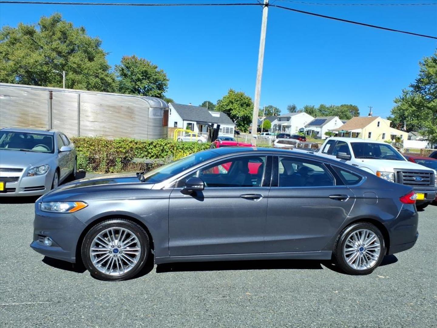 2015 Magnetic Metallic Ford Fusion SE (3FA6P0H91FR) with an 2.0L EcoBoost 2.0L Turbo I4 240hp 270ft. lbs. Turbocharged engine, 6-Speed Shiftable Automatic transmission, located at 50 Eastern Blvd., Essex, MD, 21221, (410) 686-3444, 39.304367, -76.484947 - Photo#1
