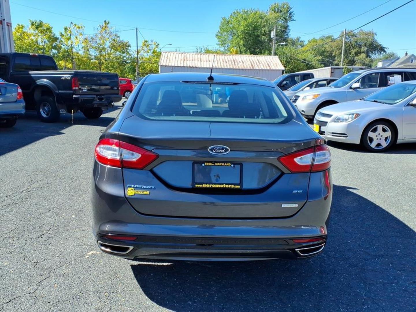 2015 Magnetic Metallic Ford Fusion SE (3FA6P0H91FR) with an 2.0L EcoBoost 2.0L Turbo I4 240hp 270ft. lbs. Turbocharged engine, 6-Speed Shiftable Automatic transmission, located at 50 Eastern Blvd., Essex, MD, 21221, (410) 686-3444, 39.304367, -76.484947 - Photo#3